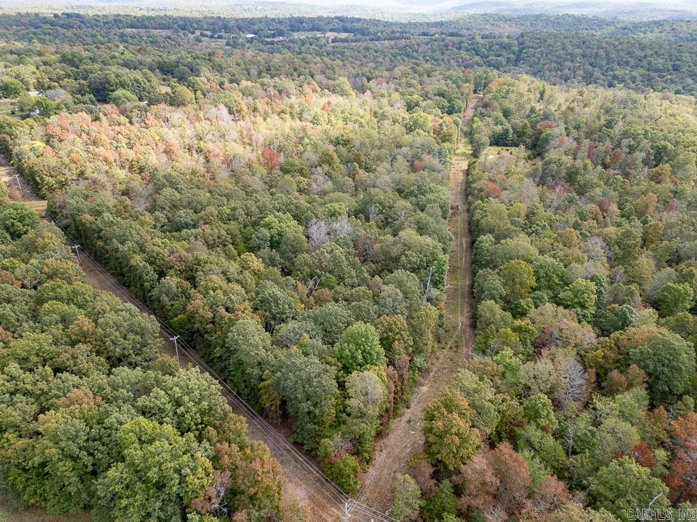 Hunt it, build on it, or simply enjoy it 60+/- acres of rolling hardwoods with a spring-fed, year-round creekāprivate, accessible, and ready for your vision.Whether youāre looking for a weekend retreat, a hunting property, or the perfect spot to build a cabin, this tract checks every box. Unlike most recreational land, it already has the essentials in place: a deep well, septic, and high-speed fiber internet. Property Highlights: ? 60 acres of mature hardwood timber ? Spring-fed, year-round creek ? Rolling terrain with natural food plot openings ? Excellent deer & turkey hunting habitat ? Trails throughout for easy access ? Deep well, septic tank, and fiber internet in place ? Highway frontage, but secluded once inside ?? A rare blend of natural beauty and modern convenienceāready for your outdoor lifestyle.