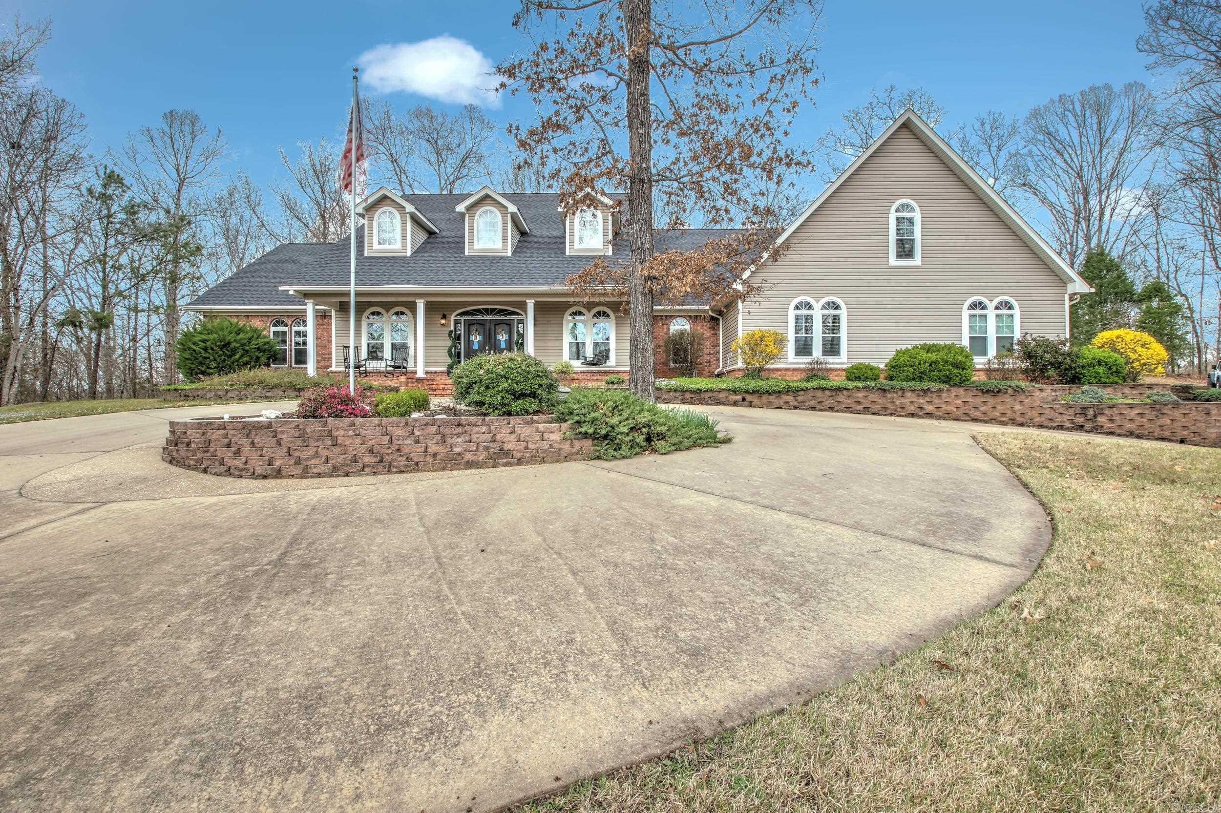 Welcome home! This 4 bed 3 bath Hilltop Vista sits on 2.25 acres and boasts over 4400sqft. So much attention to detail has been given in this elegant home. Double entry doors open your way into a formal entry. The 14-foot ceilings in the living room, and a beautiful double-sided fireplace shared with the adjacent sunroom, will be sure to be one of your favorite relaxing spots in the home. A large Kitchen with granite countertops, white cabinets, breakfast bar, double Jenn Air ovens, and appliance cabinets are just a few perks you will be sure to enjoy. The large formal dining room is accessible from entry and kitchen. A 14X14 separate primary suite boasts 2 walk in closets, one of those doubles as a concrete safe, storm room. The primary on suite has dual Granite vanities with great natural light. A walk-in shower, separate soaking tub and water closet make this bathroom a dream. Office has beautiful built-in desks, 2 bedrooms share a jack and jill bathroom, and the upstairs bonus room is huge with a separate bedroom. A whole house automatic generator, central vacuum system, 3 car garage with workshop, and beautiful landscaping make this home a must see. Call Today !