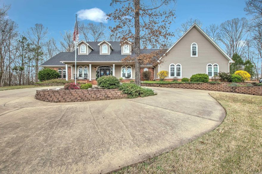 Welcome home! This 4 bed 3 bath Hilltop Vista sits on 2.25 acres and boasts over 4400sqft. So much attention to detail has been given in this elegant home. Double entry doors open your way into a formal entry. The 14-foot ceilings in the living room, and a beautiful double-sided fireplace shared with the adjacent sunroom, will be sure to be one of your favorite relaxing spots in the home. A large Kitchen with granite countertops, white cabinets, breakfast bar, double Jenn Air ovens, and appliance cabinets are just a few perks you will be sure to enjoy.  The large formal dining room is accessible from entry and kitchen. A 14X14 separate primary suite boasts 2 walk in closets, one of those doubles as a concrete safe, storm room. The primary on suite has dual Granite vanities with great natural light. A walk-in shower, separate soaking tub and water closet make this bathroom a dream.  Office has beautiful built-in desks, 2 bedrooms share a jack and jill bathroom, and the upstairs bonus room is huge with a separate bedroom. A whole house automatic generator, central vacuum system, 3 car garage with workshop, and beautiful landscaping make this home a must see.  Call Today !