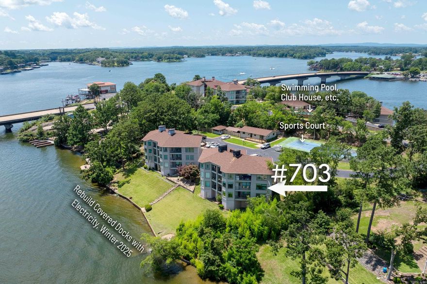 Updated Luxury Lakefront Condo in gated community of Stoneridge (Phase 4)! Fantastic Lake Hamilton frontage. What a way to start your day. Welcoming open floorplan, entry level unit with porch and 2 decks. Covered Dock with electricity will start rebuild Winter, 2025. Walk-in and take in the gorgeous lake views. Large Great Room with wood-burning fireplace, lots of windows (5 new), built-ins, smart dimmable lights (Alexa & Google), & new lighting, paint and floors. Dining Room has breathtaking bay windows. A wet bar sits conveniently between the Living Room and Dining Room with nightlights in the recessed lighting in Wetbar and kitchen hall. The Breakfast Rm/Den has new lighting (also smart dimmable Alexa/Google), with wainscoting overlooking Lake Hamilton with deck, on the other side, a galley Kitchen has marble countertops, surface range, wall oven and microwave, stainless steel appliances, and lots of cabinets and pantry. LVP and tile flooring, negotiable furnishings. Two bedrooms off the entry hall. A spacious guest bedroom with large bathroom and oversized walk-in shower. On the right is a spacious and airy Owner’s Suite with a phenomenal views and door to larger deck.