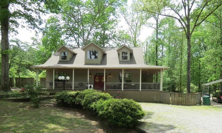 Beautiful 2 story home outside city limits of White Hall.  Beautiful big windows in  this home.  3 bedrooms and an office that could be used as 4th bedroom.  3 1/2 baths.  Master is downstairs.  Both bedrooms upstairs have their own bathrooms.  Sitting area upstairs.  Basement with approx. 683sf.  Wrap around porch.  Agents see remarks***  Taxes are after HC Credit.  Great living areas inside and out of home!!