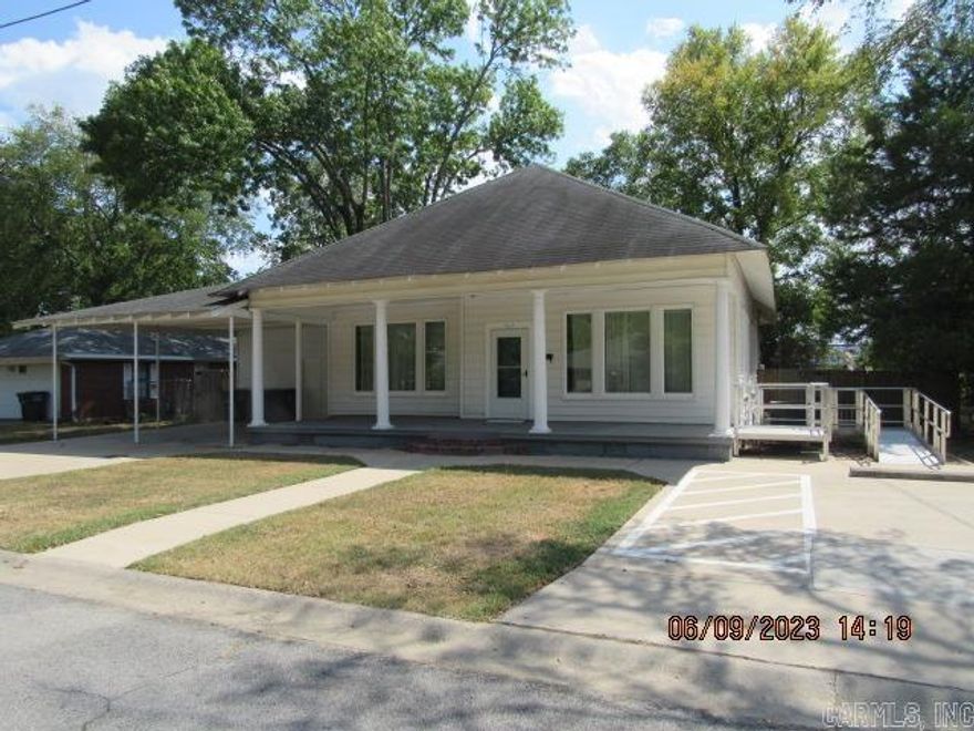 Zoned C-3 per Conway City website, perfect for a small office, large reception area, large conference area, private offices, 1/2 bath, large breakroom with new flooring & cabinets, Craftman style interior with tall moldings, fenced yard, carport, lawn care to be provided by tenant. 3 year lease minimum.