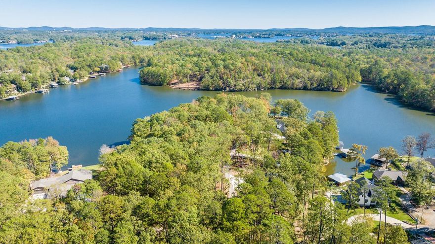 Experience unparalleled serenity and breathtaking beauty on this 2.57-acre lot located on the coveted shores of Lake Hamilton in Hot Springs, Arkansas. With over 600 feet of pristine lake frontage, this property presents a rare opportunity to build your dream waterfront estate.  Embrace the tranquility of lakeside living while enjoying the convenience of being just minutes away from local amenities. The property boasts mature trees, providing both privacy and a lush natural environment. The gentle slope to the water ensures easy access to the lake, making it perfect for boating, fishing, or simply enjoying the stunning sunsets over the water.  This exceptional lot could provide enough room for two luxurious homes within a peaceful atmosphere. The expansive shoreline offers numerous possibilities for a private dock, boating facilities, or a waterside gazebo.  Whether you are looking to build a year-round residence or a vacation getaway, this property provides the perfect. Your dream of lakefront living awaits!
