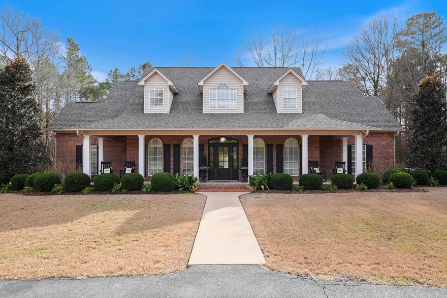 Beautifully updated in 2018 with luxury finishes this home sits on 3 level acres.  Very desirable Nestlewood East Subdivision.  Almost 4000 sq ft with 2 living areas, formal dining, breakfast area. Primary suite, guest bedroom and full bath on main level.  Has an office with outside entrance that could be a bedroom.  Full house generator with dedicated propane tank and underground storm shelter are just outside the 2 car garage. A full separate 2nd garage/shop for extra storage or vehicle.  Upstairs are 3 bedrooms and 2 full baths and additional storage.  A  landscaped patio w lighting and fire pit area for outdoor enjoyment. New roof 2024. New water heaters(2). New septic pump. New A/C downstairs. Wonderful home.