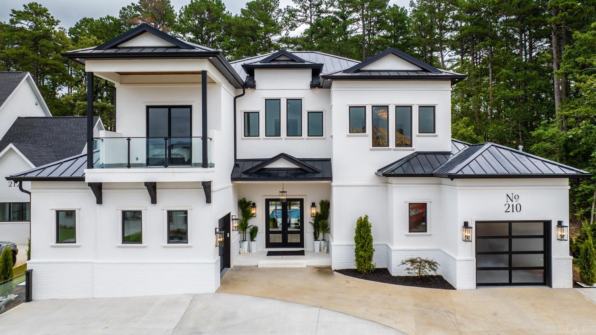 Introducing an exquisite luxury new construction listing in the prestigious West Little Rock area. This stunning home spans an impressive 4,580 square feet, featuring 5 spacious bedrooms, 5 full baths, and an additional half bath. A thoughtfully designed office space complements the living area, providing an ideal setting for work or study.  Step into a world of opulence as every inch of this residence is meticulously crafted for luxury living. The outdoor space is a true oasis, boasting an incredible pool, a captivating pergola, and a welcoming outdoor living area. With over 1,000 square feet of outdoor living space, including a full bathroom, this home seamlessly blends indoor and outdoor living, creating a harmonious sanctuary.  The roof is adorned with sleek metal, a modern touch to the architectural design. This home is truly extraordinary and a must-see for those seeking the epitome of refined living. Best opportunity to experience the pinnacle of luxury in West Little Rock.  Home highlights: incredible landscape, 8 Camera Security system, outdoor grill, mini refrigerator and sink,  spray foam insulation, ice maker, all appliances with washer and dryer included & more