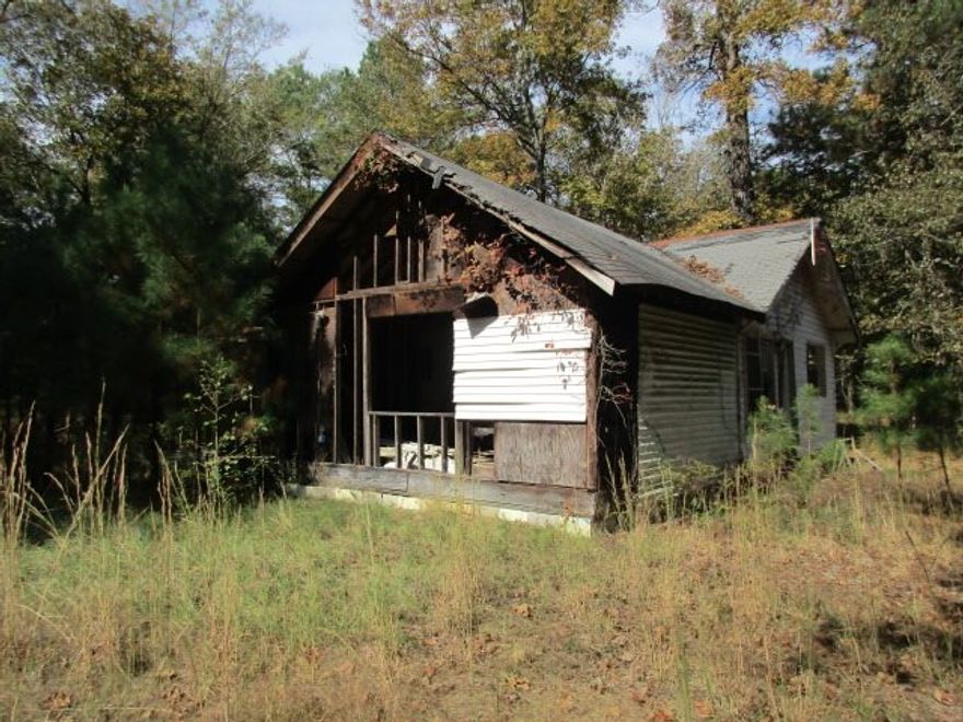 A fixer upper or tear it down and build your dream house. 2 parcels of land making approx. 6.13 ac.