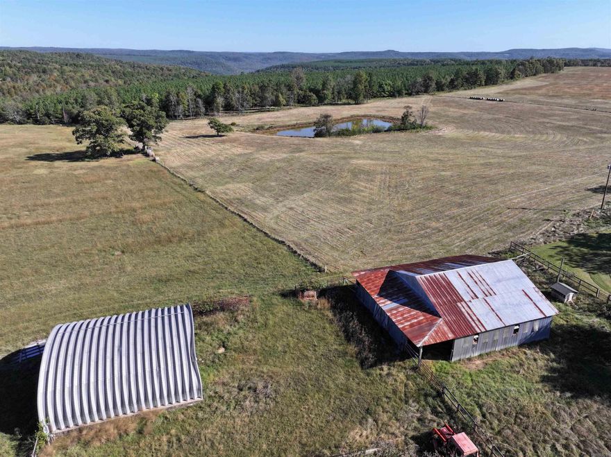 It's a rarity to be in rural Van Buren County yet have paved road frontage, multiple barns, a pond, public water access, electricity available, and high-speed internet service all on the same tract. But this one has all of those! Not to mention several acres of pristine pasture for your use whether building a home, cutting hay, or running cattle/horses. In addition to the pasture acreage is both planted pine and natural hardwoods. This tract is 50 +/- acres and is located approximately 20 minutes West of Clinton, Arkansas off of highway 16. If you need more acreage, there is an additional 56.3 +/- acre tract adjoining that is listed for the same price/acre.