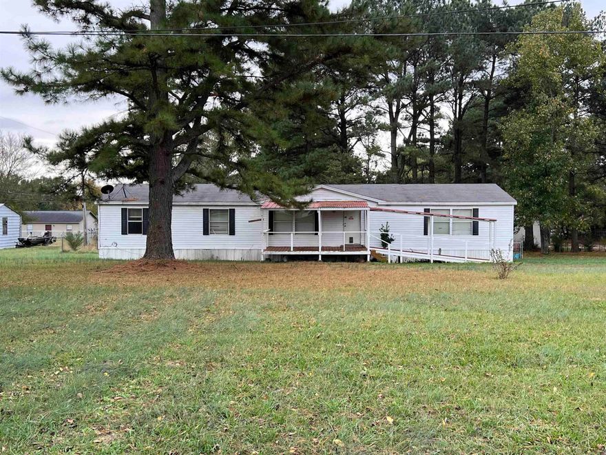 Located in a quiet neighborhood in Judsonia, AR, this 2005 double-wide mobile home offers a fantastic opportunity for those looking to invest in a fixer-upper with great potential. Featuring 4 bedrooms and 2 bathrooms, this home provides ample space for anyone needing extra room. Situated on 3 generous city lots, the property includes a fenced-in backyard and HUGE front yard! While the home does require some repairs and updates, its solid structure and expansive lot make it a diamond in the rough. Whether you're looking to renovate and create your dream home or develop the land for future opportunities, the possibilities are endless. With 4 bedrooms, there’s plenty of space, and the large lot provides plenty of privacy and room for outdoor activities. In fact, one might even build a second home on site! This home is priced to sell As Is, and may be an ideal project for buyers who can imagine the possibilities. Located in a peaceful, established neighborhood, it's just a short drive to local amenities and schools. Don’t miss your chance to own this diamond in the rough—schedule a showing today!