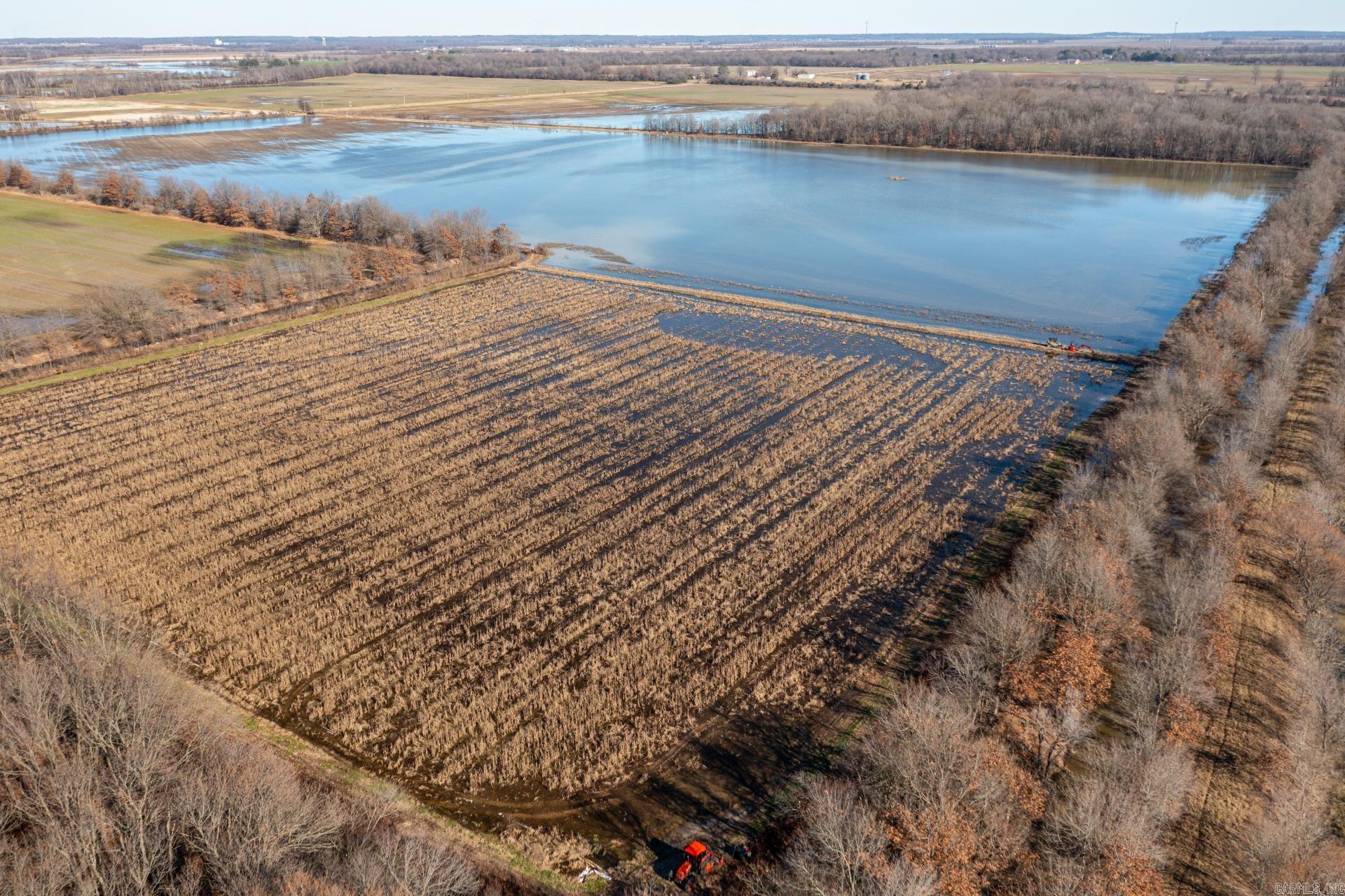Experience the ultimate in duck hunting and farming with this exceptional 104 +/- acre turn-key property in Craighead County, Arkansas. Located just minutes from Jonesboro and within an easy drive to Memphis, this property offers a perfect mix of green timber and flooded grain field hunting, surrounded by some of the most famous duck clubs in Northeast Arkansas. This farm provides an ideal setup for diverse hunting experiences, with strategic blind placement for both timber and field hunting. In addition to duck hunting, the property is situated in a prime speckle belly goose flyway and offers excellent deer hunting opportunities. For those looking to combine farming with recreation, the land features profitable row crop acreage that adds an income-generating aspect to this property. Ready for immediate use, the property includes everything needed for a successful hunting season, while also offering the convenience of easy access throughout. Surrounded by renowned duck hunting areas and close to both local amenities and major cities, this property is a rare find.