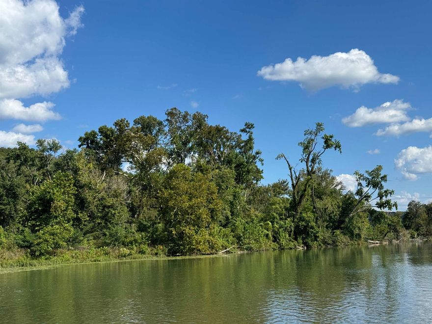 Country acreage with Spring River frontage - Great recreational property. Build a cabin / house. Good turkey hunting. Power 200 amp meter box already on property. Well casing drilled and ready for pump. Fiber optic available at power pole. Property has railroad track running thru property, no crossings near by and no train horns. River front on other side of tracks. Existing survey on file. Road frontage area is flat and buildable. The portion where meter and well are is not in the flood plane. This could be a great get a way property. No restrictions for building. Property provides 170 ft of Spring river frontage.