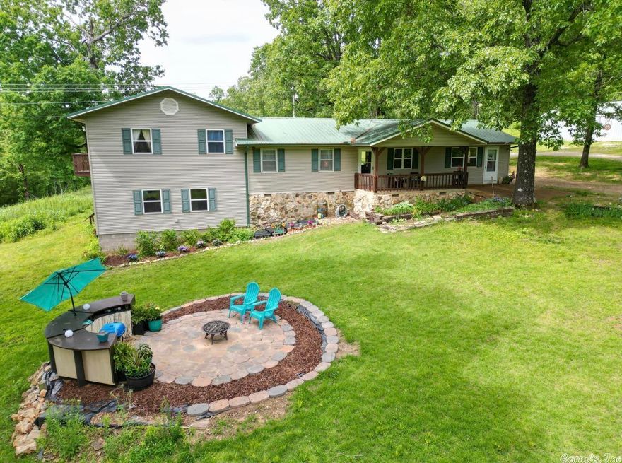 5 bedroom 2 bath Country home on 14.7 acres+/- with 30x40 shop/garage on a paved road near Harold E. Alexander Spring River Wildlife Area. Property is mostly wooded, has multiple different fruit trees like apples and peaches, plus right up the road from the beautiful Big Creek. The main level of the home includes living, dining, kitchen, utility room, bedroom, full bath, plus office area. Walking into the office area leads upstairs to the Primary bedroom with full bath & a balcony for enjoying the full 4 seasons our Natural state has to offer. 3rd bedroom on the same level. Venture back to the office area and travel down the stairs into the bottom level that includes bedrooms 4 & 5 plus a large living area. Such a well maintained home in a desired area of Sharp County. Close to town amenities yet out in the Ozark Mountains! Bonus from sellers they are including their lot in Cherokee Village AR. PARCEL 284-00059-000. Lot gives you access to the beach on Lake Sequoyah, Lake Thunderbird as well as several fishing lakes,  pools, golf courses, and so much more!