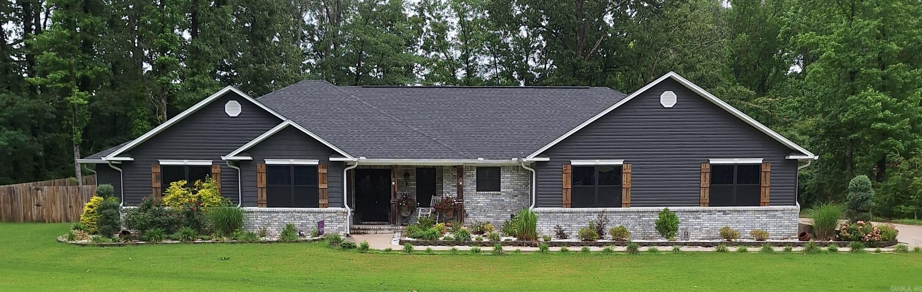 Stunning custom built home with 3 BR, separate office, 2.5 baths. Attention to detail is evident the moment you walk in, including beautiful Kardean floors and marble countertops throughout. Kitchen boasts a huge island with storage along with an abundance of cabinets, 5 burner gas stove and double oven. Spacious master BR with jacuzzi tub and amazing 5 x 4 walk in shower and 10 x 11 closet. Beautiful living area with gas fp and plenty of natural light. Covered patio perfect for relaxing or entertaining with dining and seating area featuring 2nd gas fireplace plus plumbed for gas for possible outdoor kitchen. Two 30 x 30 garages with storage, room for boat and one side built to be easily enclosed into living space. Whole home generator, gas "on demand" water heater means never being without modern conveniences. SO MUCH MORE! Call to make this beauty yours! AGENTS SEE SHOWING REMARKS.