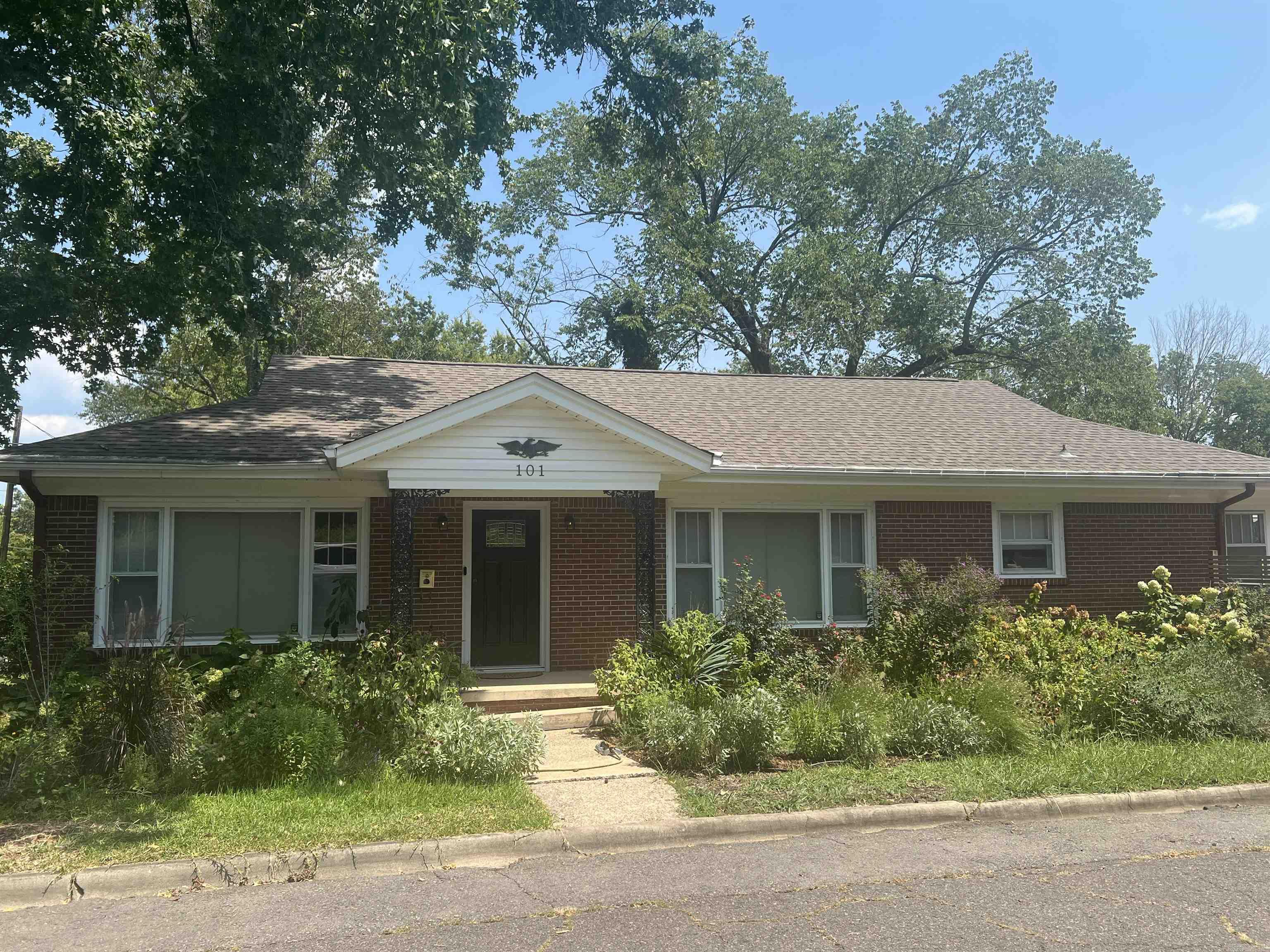 Charming Brick Home on Corner Lot! This spacious home features a stunning wall of windows that fills the living room with natural light. Enjoy both a formal dining room and an eat-in kitchen, perfect for entertaining or casual meals. Offering 3 bedroom plus an office, there is plenty of space for work and relaxation. The basement provides extra living or storage options, while the detached double garage adds convenience. Situated on a desirable corner lot, this home combines classic style with modern function. Nicely landscaped yard. Don't delay, call today to see this beautiful Home. New pictures coming 8/19/25!