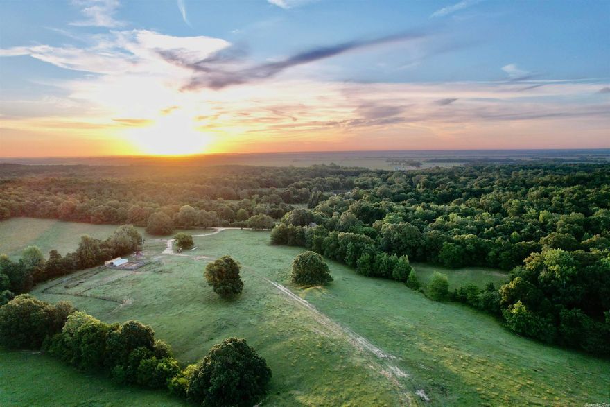This gorgeous 70 acre farm, located on Crowley's Ridge just south of Jonesboro, Arkansas, has endless opportunities.  From the highest point on the property, you can overlook farmland to the west and take in breath-taking sunsets.  The rolling topography offers 60 acres of pasture and 10 acres of timber that's perfectly suited for cattle farming, deer hunting, or recreational/subdivision potential.