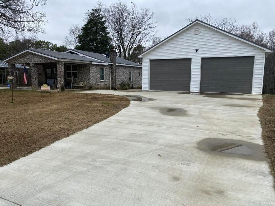 This is a lovely property located at 20349 Greenfield Road, Harrisburg AR. The lot is 3.8 +/- acres of rolling land and it has a 2 bedroom, 1 bath home with some nice updates. There is also a detached, newer 2 car garage and a smaller workshop on concrete pad with electricity. In the last several years the home has undergone updates to the kitchen, bathroom, flooring. The utilities are:  Craighead Electric, Empower internet, Crowley's Ridge Water, Harrisburg gas.