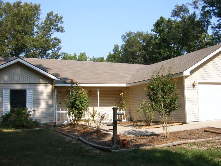 Three bedroom two bath home with a wonderful setting.  Corner gas log fireplace, sunroom and partial basement.