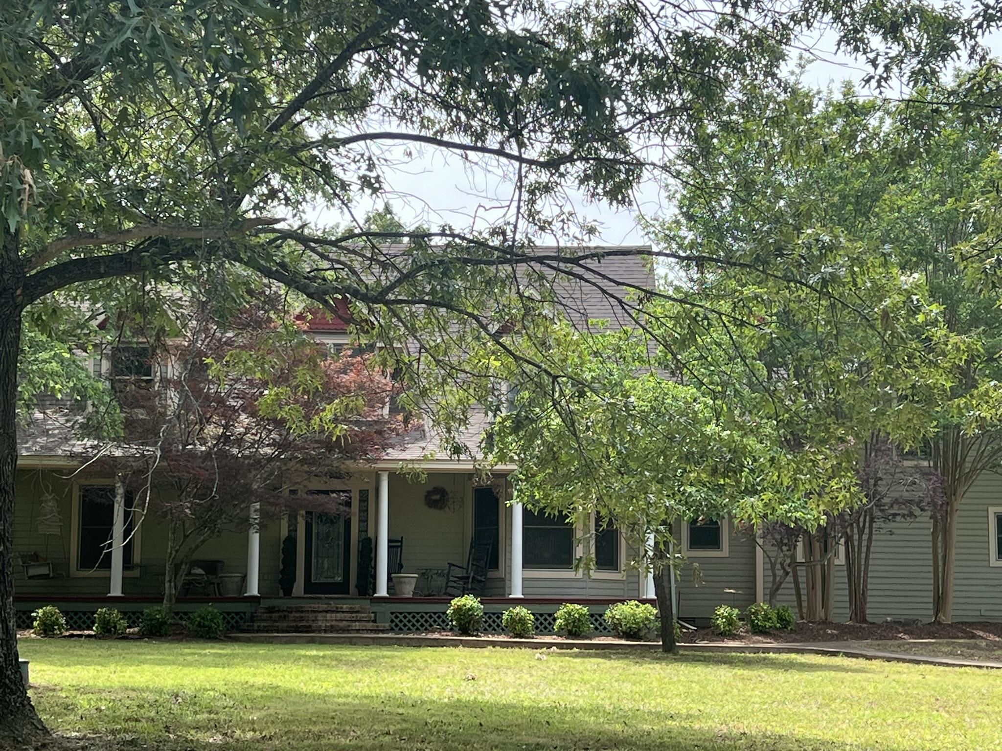 YOUR 'PLANTATION COUNTRY HOME' is 'move in ready' for a new owner!! Located on aprox.1.5 acres with large hardwood shade trees & beautiful landscaping. Quality built, home features: 4 bedrooms/ 2 1/2 baths, a gourmet eat in kitchen with 10 ft island, gas range, lots of cabinets with granite countertops. Other features: hardwood flooring, living room has an impressive vaulted ceiling, separate formal dining area, laundry room w/sink,1/2 hall guest bath & the generous primary bedroom en-suite with walk in closet. The primary bath has granite touches & a large tile shower. The other bedrooms are upstairs with another full bathroom & large living space or game room. Living room downstairs has French doors leading outside to the private veranda with flowering plants, ferns & canopying crepe myrtles trees. The level shaded estate offers a beautiful private shaded setting with a family firepit & a concrete pad for extra parking. There is a bonus room for additional space ready to complete for mother-in law suite if desired. It already has plumbing stubbed in for an additional full bath. Home is close to amenities, but in a private, quiet, up scale neighborhood.