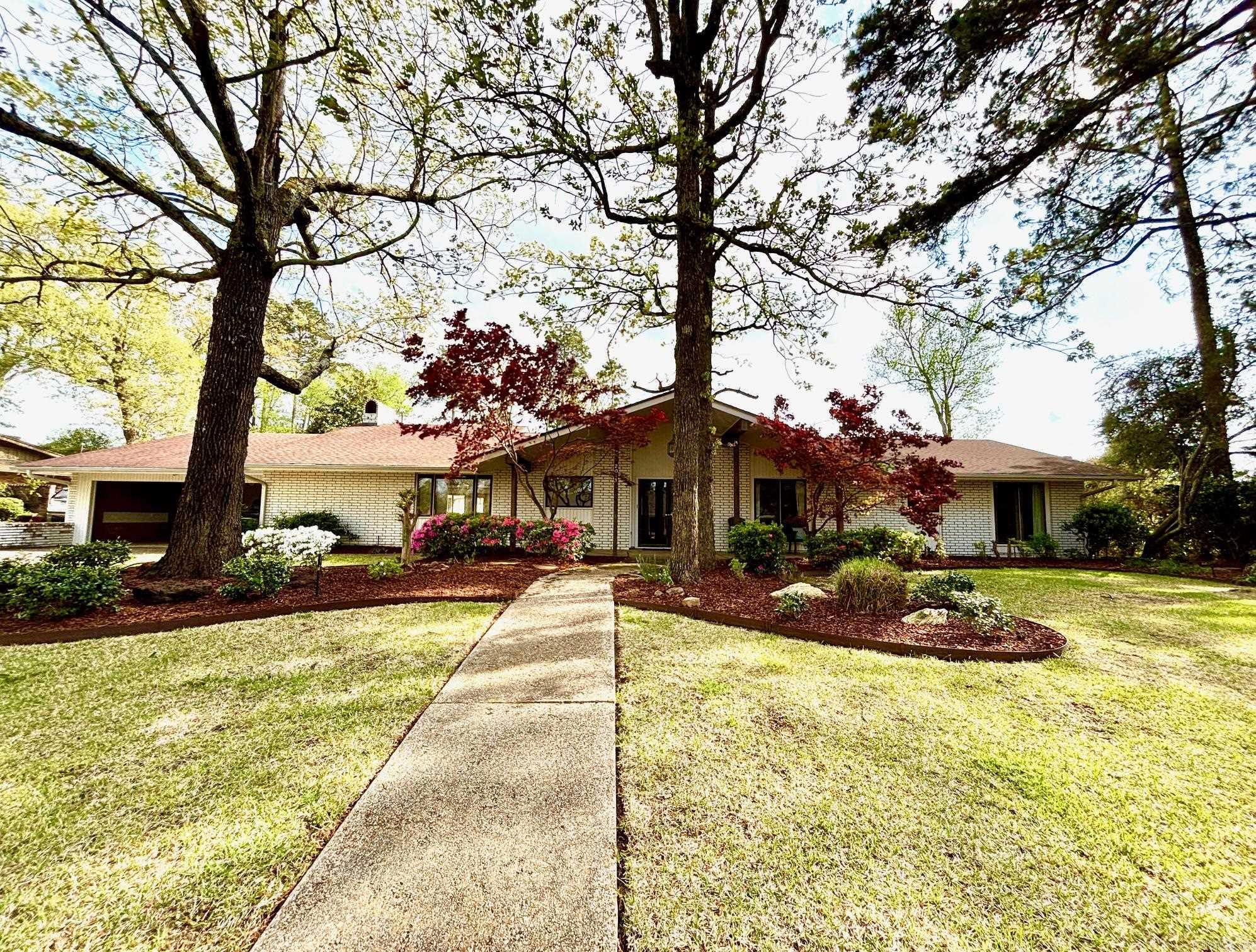 A well maintained home in Thompson Heights Fifth Subdivision (West of Timberlane), 2011 West Elm Street is a spacious 3,838 sq/ft with 4 bedrooms and 4 full bathrooms and 2 half baths. Spacious 450+ sq/ft primary suite with Jacuzzi tub and separate shower on one end of the house and 3 additional bedrooms (2 with ensuite bathrooms) on the other end with formal living/dining space, family room with fireplace and eat-in kitchen in the center of the home. Great entertaining space with tons of natural light. Large fenced in backyard with sprinkler system for entire yard and flower beds. Also included in this sale is Lot #37 located directly behind the property with frontage on West Main Street.