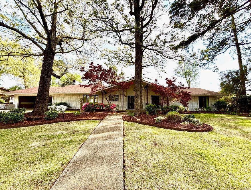 A well maintained home in Thompson Heights Fifth Subdivision (West of Timberlane), 2011 West Elm Street is a spacious 3,838 sq/ft with 4 bedrooms and 4 full bathrooms and 2 half baths.  Spacious 450+ sq/ft primary suite with Jacuzzi tub and separate shower on one end of the house and 3 additional bedrooms (2 with ensuite bathrooms) on the other end with formal living/dining space, family room with fireplace and eat-in kitchen in the center of the home.  Great entertaining space with tons of natural light.  Large fenced in backyard with sprinkler system for entire yard and flower beds.  Also included in this sale is Lot #37 located directly behind the property with frontage on West Main Street.