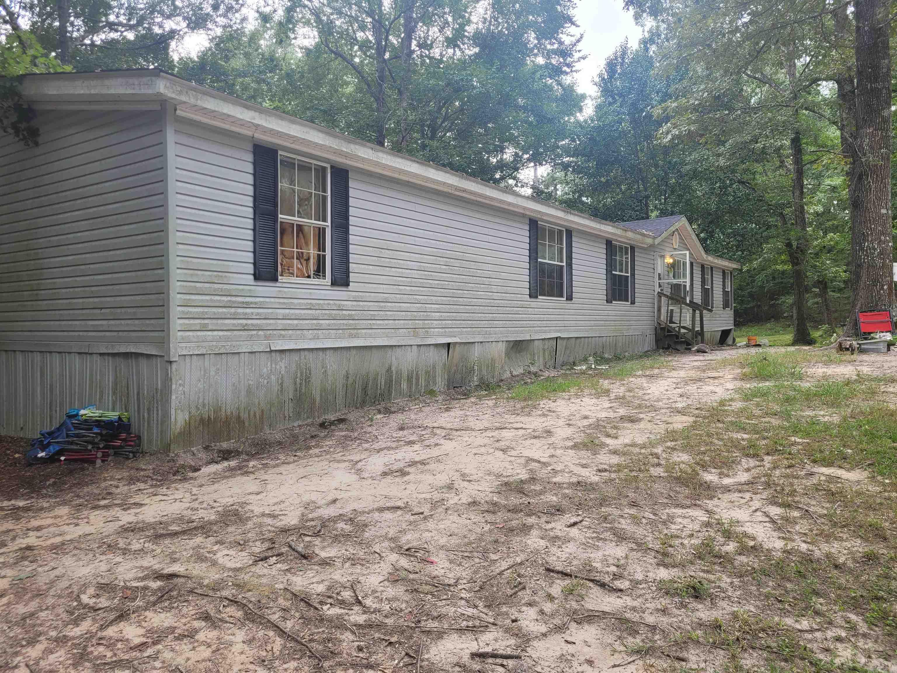 Spacious 2009 Manufactured Home on 3.59 Acres This 4-bedroom, 3-bathroom home offers 2,128 square feet of living space, providing plenty of room for the whole family. Situated on 3.59 acres, the property offers privacy, outdoor potential, and a country feel while still being conveniently located. Key updates include a new roof, central heat & air system, and hot water tank in 2022, ensuring peace of mind for years to come. This property is perfect for those seeking space and comfort all on a beautiful piece of land.