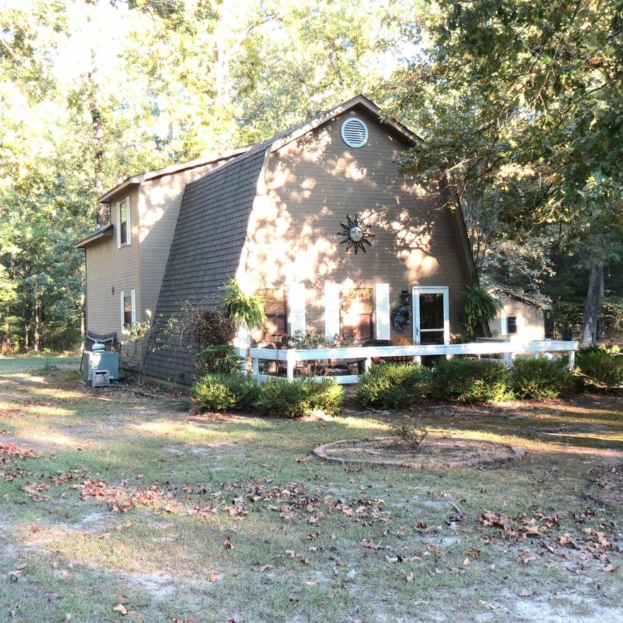 Escape to your personal retreat in this great A-Frame home, nestled on almost 2 acres of land.  Living room has vaulted ceilings, opens up to an inviting kitchen.  This cozy living room has gas fireplace, ideal for chilly evenings.  Primary bedroom downstairs, walk in closet.  2 bedrooms and bath upstairs.  Laundry room.  Step outside onto a great front porch to watch the wildlife.  20x20 shop with electricity and a lean to on the back. Taxes are before Homestead Credit!!  Rural Development loans for this area, could be a great loan choice with "No Down Payment".  Call today for more information.