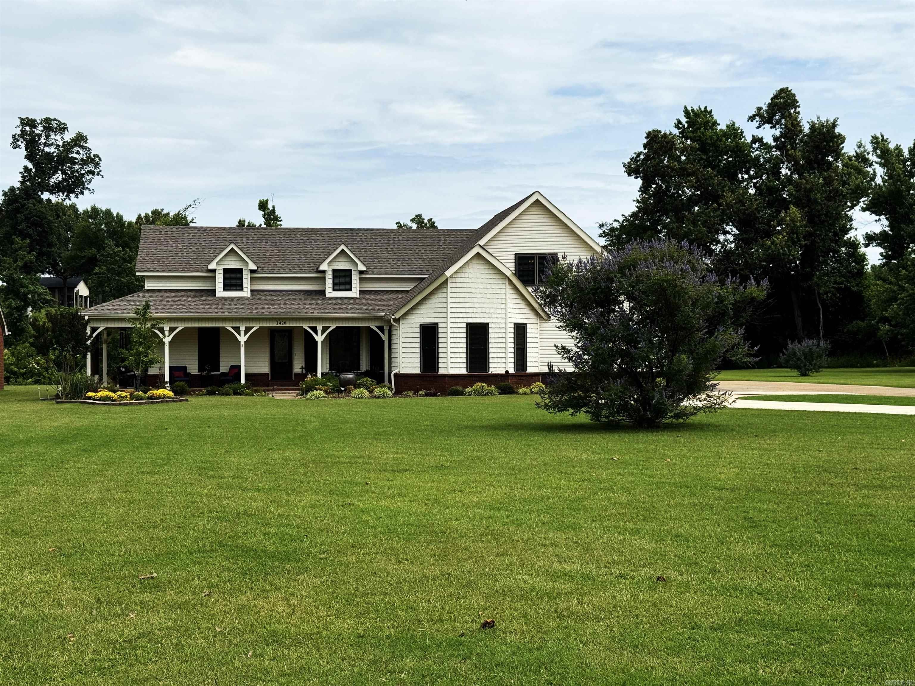 You have to see this home to believe the attention to detail in the updated flooring, baths, beautiful landscaping and more! A new roof was installed in 2023, triple pane windows in 2017 or 2018, water heater with a circulating pump in 2025, and approximately 90% of the furnace was updated 4 years ago. As you enter the front door, the dining area and kitchen are to the right and the family room with a pretty gas log fireplace is straight ahead with guest bedrooms on the left and primary suite behind the kitchen. The kitchen features an updated back splash, microwave and drop-in stove. A breakfast room and laundry room with a row of wonderful cabinets are conveniently located off of the kitchen and leading to the garage. The 16 x 16 primary bedroom has crown molding, and beautiful bath features double vanities, lighted medicine cabinet mirrors, glass tile back splash, toilet closet, jetted tub and separate shower. A 4th bedroom or bonus room has a nice closet and bath with a shower. The patio is perfect for grilling, a 20 x 40 shop with foam insulation, a/c and gas heat is an added bonus, and the generator remains.