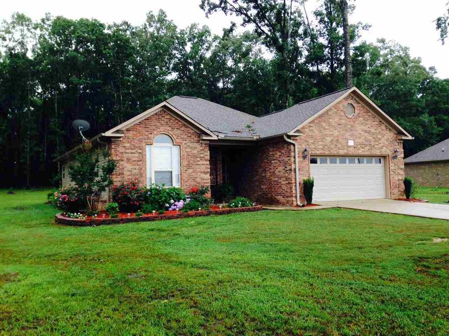 Great home in a beautiful country setting! This 3 bedroom 2 bath house is perfect for your family. Enter into a huge living room with a wonderful fireplace. The split floor plan is dripping in crown molding. The kitchen has stainless steel appliances and a large island. Master bedroom has tray ceiling and the master bath have double vanities, jetted tub and separate shower. The one acre lot leaves you lots of room to spend time with the family.