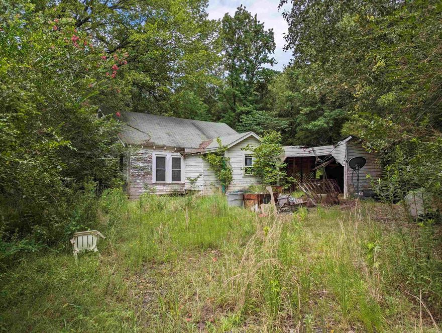 A rarity!!  This property is located Between Aplin and Nimrod communities on north side of highway.  Most popular reason to purchase is its 9.0 miles from Lake Nimrod, one of Arkansas's best fishing lakes.  Utilities are on site, public water, electric and  septic sewer.  House is not livable and probably not repairable.  Wonderful location for a camper or RV to enjoy the Ouachita National Forest and area lakes.  It would make  a good home site as well.  This is an up slope lot with step grade.  Please! "NO TRESSPASING REALTOR MUST ACCOMPANY"  Seller to retain 49% of mineral rights.