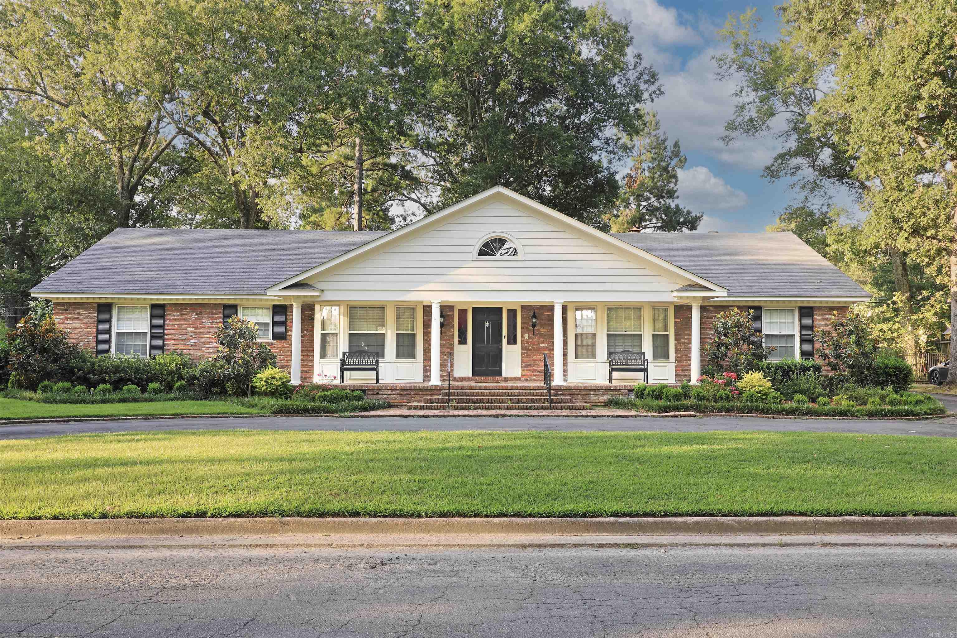 Welcome to this beautifully maintained and thoughtfully updated traditional home offering 3 bedrooms, 2 full bathrooms, and 2 convenient half baths. From its inviting curb appeal to its elegant interior touches, this home blends classic charm with modern comfort. Inside, you'll find two cozy dens perfect for relaxing or entertaining—one of which easily functions as a fourth bedroom option, ideal for guests or a growing household. The hall half-bath offers a simple conversion opportunity into a third full bathroom, adding flexibility for future needs. Step onto newly installed luxury vinyl flooring that flows throughout, complemented by fresh paint and eye-catching designer wallpaper for a curated, stylish feel. A charming office nook provides a quiet workspace, while thoughtful features like new gas logs, new blinds, storm windows and doors, and upgraded security doors enhance both comfort and peace of mind. Enjoy year-round efficiency with a brand-new HVAC system and cozy up by the fire in one of the warm, inviting living areas. This home is a perfect blend of elegance and practicality, ready to welcome its next chapter.