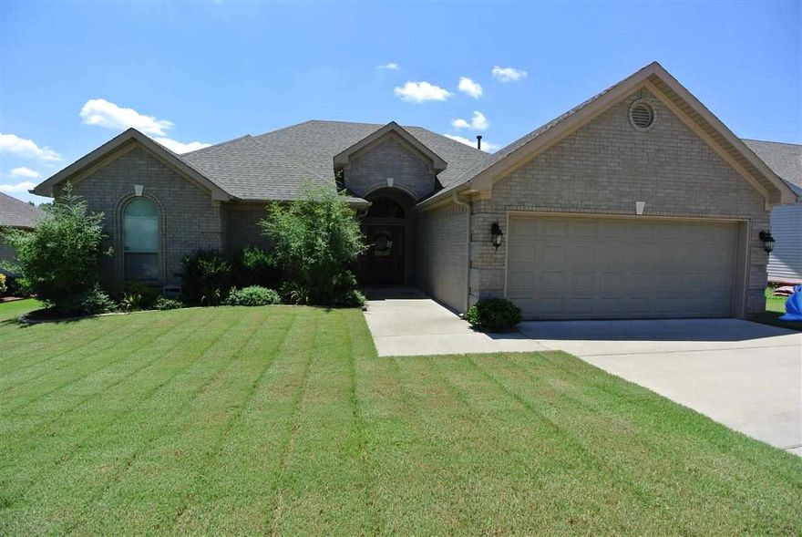 Adorable home in immaculate condition. Hardwoods, tile, granite thru-out, high ceilings, extensive trim & crown molding & energy efficient w storm shelter. 4 bedrooms/2 bath. Great room has fireplace w gas logs. Kitchen has pantry, stainless steal appliances, breakfast bar. Spacious master sits apart with double trey ceiling, huge walk in closet, separate whirlpool & custom tile shower. Other bedrooms are good sized with large closets!  Deck on back, fully fenced! Gutters & alarm!  Bryant Schools!