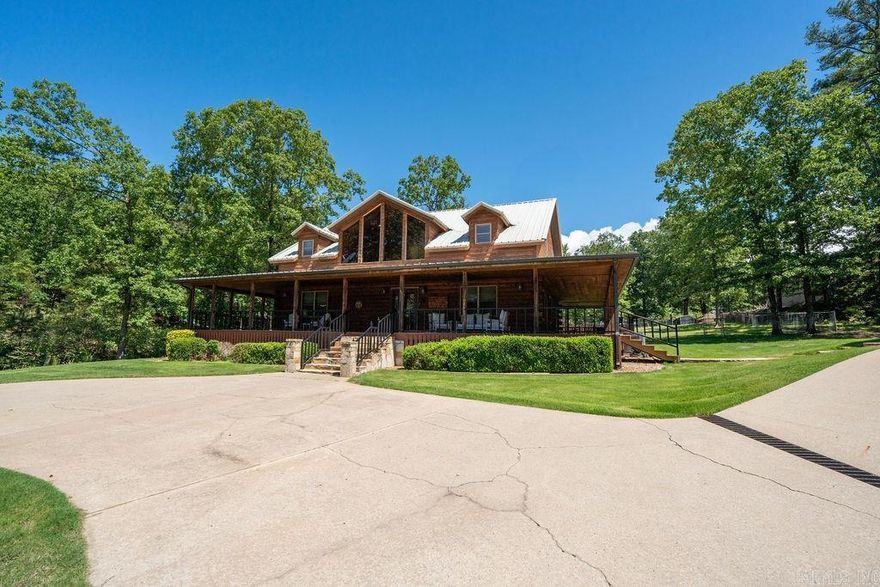 Motivated Sellers. Escape to your own retreat on 5 acres just outside of town! This stunning log home features a paved driveway, a wet weather creek, an above-ground pool, and a fenced yard for peaceful days by the water. Unwind on the wrap-around porch or fire up the grill in the cozy covered grilling nook. A 4-car detached garage with partially finished living space above adds even more charm. The 30x40 shop with soaring 14' ceilings is heated/cooled and perfect for all your hobbies. Inside, enjoy 3 spacious bedrooms with walk-in closets, updated bathrooms, and a beautifully refreshed kitchen.  A separate drive leads to the shop with plenty of space for all your projects. Just 2 miles from Cow Shoals for world-class fly fishing and 6 minutes to downtown Heber Springs!