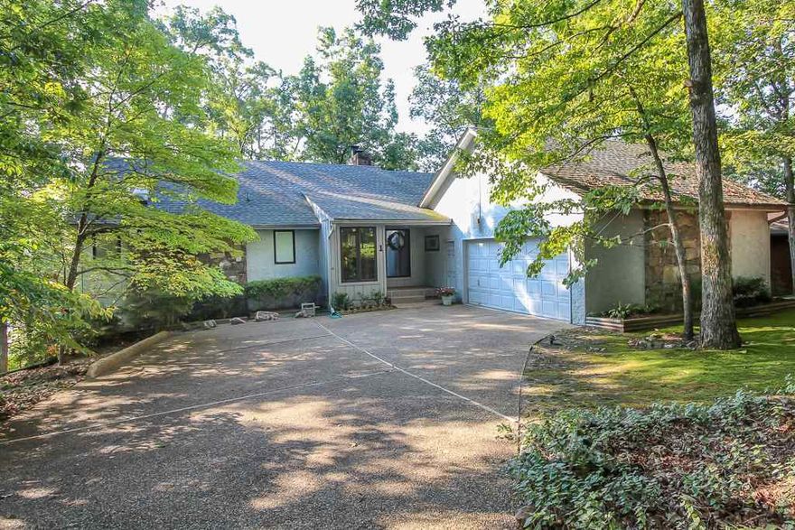 BEAUTIFUL SETTING ON LAKE CORTEZ. CUSTOM BUILT HOME WITH  HARDWOOD,TILE  AND CARPET FLOORING.ROOMY LIVING ROOM WITH OVERSIZED WINDOWS TO CAPTURE THE VIEW,FIREPLACE AND VAULTED CEILING. LARGE KITCHEN WITH GRANITE COUNTERS, ISLAND COOKTOP AND OODLES OF CABINETS. HEARTH ROOM WITH DOUBLE SIDED FIREPLACE. SUNROOM OVERLOOKING THE LAKE. LOWER LEVEL OFFERS FAMILY ROOM WITH ENTERTAINMENT BAR AND FIREPLACE, GUEST BEDROOMS AND FULL BATH. PATHWAY LEADS TO THE BOAT DOCK.