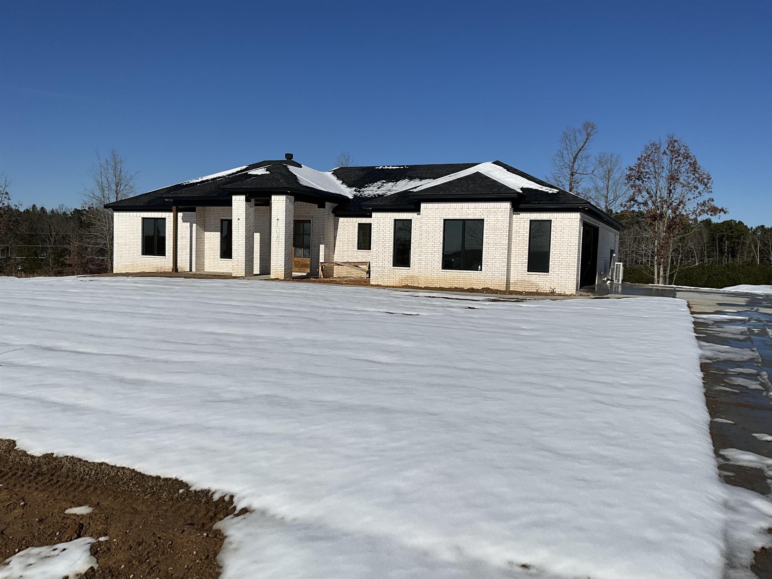 This beautiful 2,355 square foot home is set on a sprawling 5-acre lot, featuring a stunning wooded backyard that enhances its natural charm. The open-concept layout promotes a seamless flow throughout the living space, while energy-efficient design elements contribute to lower utility costs and environmental sustainability. The residence includes four spacious bedrooms and a dedicated office, making it perfect for both relaxation and productivity. With 2.5 bathrooms, the home offers convenience for family members and guests alike. The kitchen is equipped with high-quality quartz countertops, adding a touch of elegance, and laminate flooring flows throughout the main areas, complemented by tile in wet areas for durability and style. Additionally, a 15ā x 30ā shop provides valuable space for storage, hobbies, or a workshop, adding to the versatility of this exceptional property.