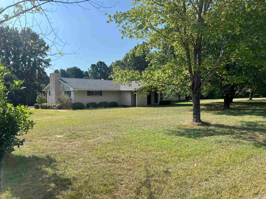 Charming three-bedroom, two-bath home nestled on 34.28 acres, offering both space and character. This home features a bright sunroom, a formal living room that could serve as a fourth bedroom, a cozy den with an electric fireplace, and a breakfast nook alongside a designated dining area. One of the bathrooms conveniently shares the laundry space, and there’s ample closet storage throughout. Accented with tongue-and-groove paneling, the home exudes warmth and rustic charm. Once a profitable tomato farm, the land offers endless possibilities for gardening, farming, or simply enjoying the peaceful countryside. There is another home on property that is used as storage and not livable.