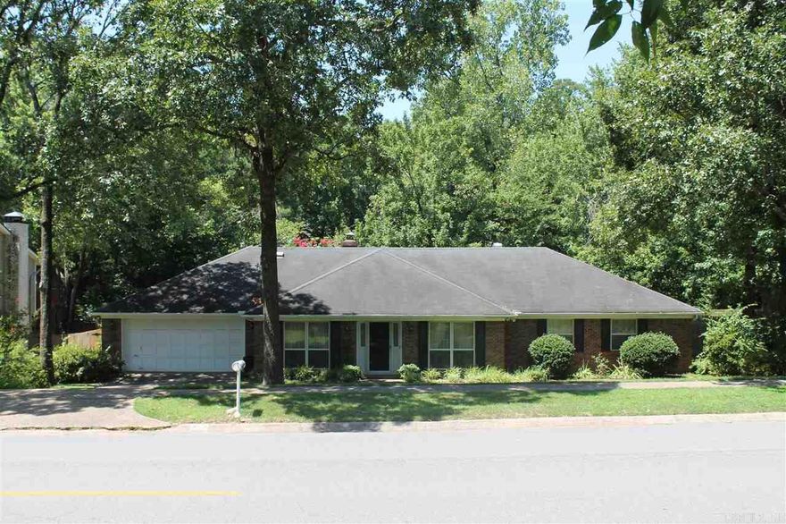 One level fixer upper just off Pleasant Valley Drive. 3 Living areas-Formal living room, formal dining room, greatroom with fireplace and cathedral ceiling, hearth room with wet bar off of kitchen. Bonus room and laundry room. Two car garage.