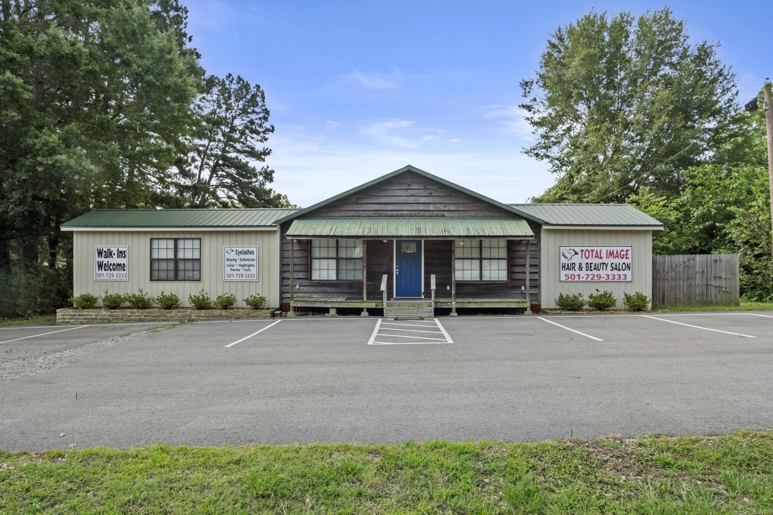 Fully furnished 1,558 sq ft salon on a highly traveled highway! Recently remodeled and move-in ready with LED lighting, new flooring, paint, trim, and updated salon equipment/furniture. Energy efficient with brand-new HVAC (2025); mini-split units still in place and usable. Layout includes a large open room ideal for salon specialty work that requires privacy or could be leased as an office, a spacious kitchen area that could serve as a break room or workspace, and a back room with storage, washer/dryer, and half bath. Large backyard offers room for expansion or additional parking. High speed internet available. Endless business opportunities!