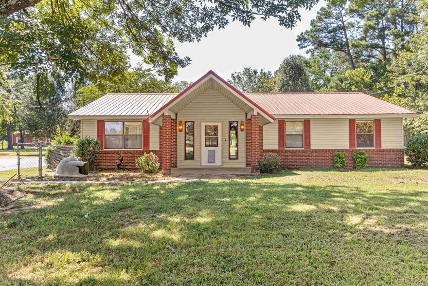 Serene retreat nestled on 7 +/- acres of picturesque land; this captivating property boasts an array of features that will leave you breathless. A spacious shop stands ready to accommodate all your hobbies and projects. Nature lovers and adventure seekers will thoroughly enjoy not one, but two stocked ponds on the property. With plenty of pastureland, fenced areas designed for your beloved livestock and animals, and timber to enjoy, this is truly a haven for both humans and animals alike.   Step inside this home and be greeted by three inviting bedrooms that you can unwind in. Two well-appointed bathrooms ensure convenience and comfort for all who reside within these walls.   Other features include a two-car garage, metal roof, back patio, awning, new carpet in two bedrooms and LVP in the living area and hallway.   Embrace the endless possibilities offered by this extraordinary property - from hosting unforgettable gatherings to creating cherished memories with loved ones at every turn. This property is guaranteed to have new owners soon!