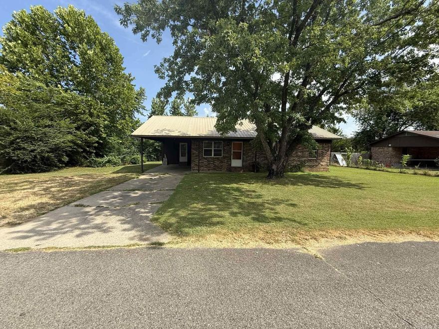 Welcome to 1803 E Harkey ST, a single-family residence in Paris, Arkansas, built in 1980. The metal roof provides years of service. This property offers a unique opportunity to create your ideal living space on a manageable .27 acre lot. With three well-proportioned bedrooms and a large bathroom with tiled step in shower. This home has an open kitchen, dining, and living area. It presents a canvas for personalized living.