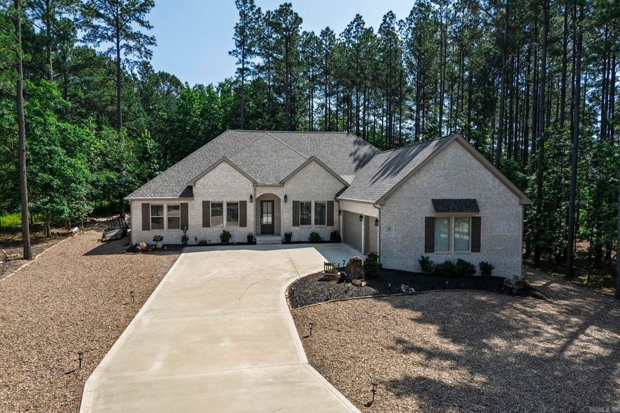 This stunning 3 year old brick home located on the #16 tee of Granada Golf course, offers a perfect blend of modern luxury and comfort.  With 3BR/2.5B and a private office, it's ideal for both relaxation and productivity.  The open kitchen boasts beautiful cabinetry, a gas range, built-ins, and separate pantry for ample storage.  The open floor plan features a vaulted wood beam ceiling, a cozy gas fireplace with built-ins on each side.  Upgrades include energy efficient automated Hunter Douglas Silhouette Power view shades with Wi-Fi smart home integration, professionally installed gutters and leaf guards along the entire perimeter of home, Reme Halo LED whole house air purifier, drip irrigation system, and solar lights on driveway and patio.  Upgraded carpet pad feels like walking on air!  Professionally installed stone border around landscape beds which finish off the yard for a beautiful touch.  Step outside to a covered patio overlooking the backyard and golf course.  The 3 car garage boasts a stairway to storage area above, and with over 1/2 acre lot you get loads of privacy like country living!  Truly a MUST see home!