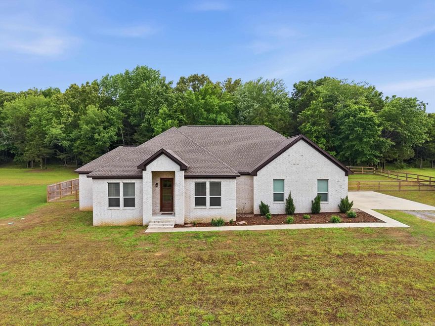Tucked away on a spacious 1.09 acre lot in Springhill, this 4 bedroom, 2 bath home built in 2022 offers the perfect blend of privacy and convenience, just one minute from Hwy 65. Inside, an open-concept split floor plan creates an easy, functional flow, complemented by thoughtful upgrades like an electric fireplace, double oven (with air fryer feature), walk-in pantry and mud room. The primary suite is a true retreat, featuring a relaxing soaker tub, while the covered back patio overlooks a tree-lined, fully fenced backyard that is ideal for unwinding or entertaining. Don’t miss your chance to own a move-in ready home with space and a great location. Schedule your showing today. (Agents see remarks)