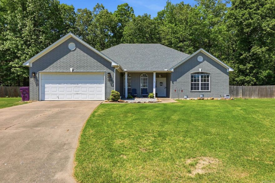 Welcome to this beautifully maintained home in Pleasant Pointe. Offering 1,856 sq. ft. of single-level living space, this property features 4 bedrooms and 2 full bathrooms. Step inside to a welcoming den centered around a cozy gas-log fireplace. The highly functional layout includes a separate dining room for formal meals and an eat-in kitchen complete with a breakfast bar and all stainless steel appliances. Durable tile and vinyl flooring run throughout the home for easy maintenance. All 4 bedrooms, including the primary bedroom, bath and  closet, are conveniently located on the main level. Enjoy the convenience of modern window treatments, ceiling fans, and a dedicated laundry room. Outside, relax in the fully fenced backyard situated on a level lot. Notably, the property features solar to supplement the central electric heating and cooling. Conveniently located with easy access to N Reynolds Rd and local amenities. Updates include: painted brick, granite countertops throughout, hardware throughout, fence, paint and so much more!