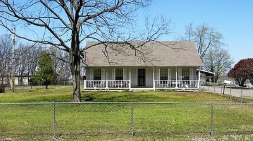 This three bedroom and two bath home is nestled on a 3.28 acre lot with a lovely pond. There is an open living room/dining room concept with wood flooring. The kitchen is equipped with range, dishwasher, microwave, trash compactor and refrigerator and has a breakfast bar. The primary bedroom is large and has carpeting and it's own private bath. There are an addition two bedrooms and bathroom. You step into the laundry room from the two car garage. The pond view is lovely and relaxing. This is a one owner home.