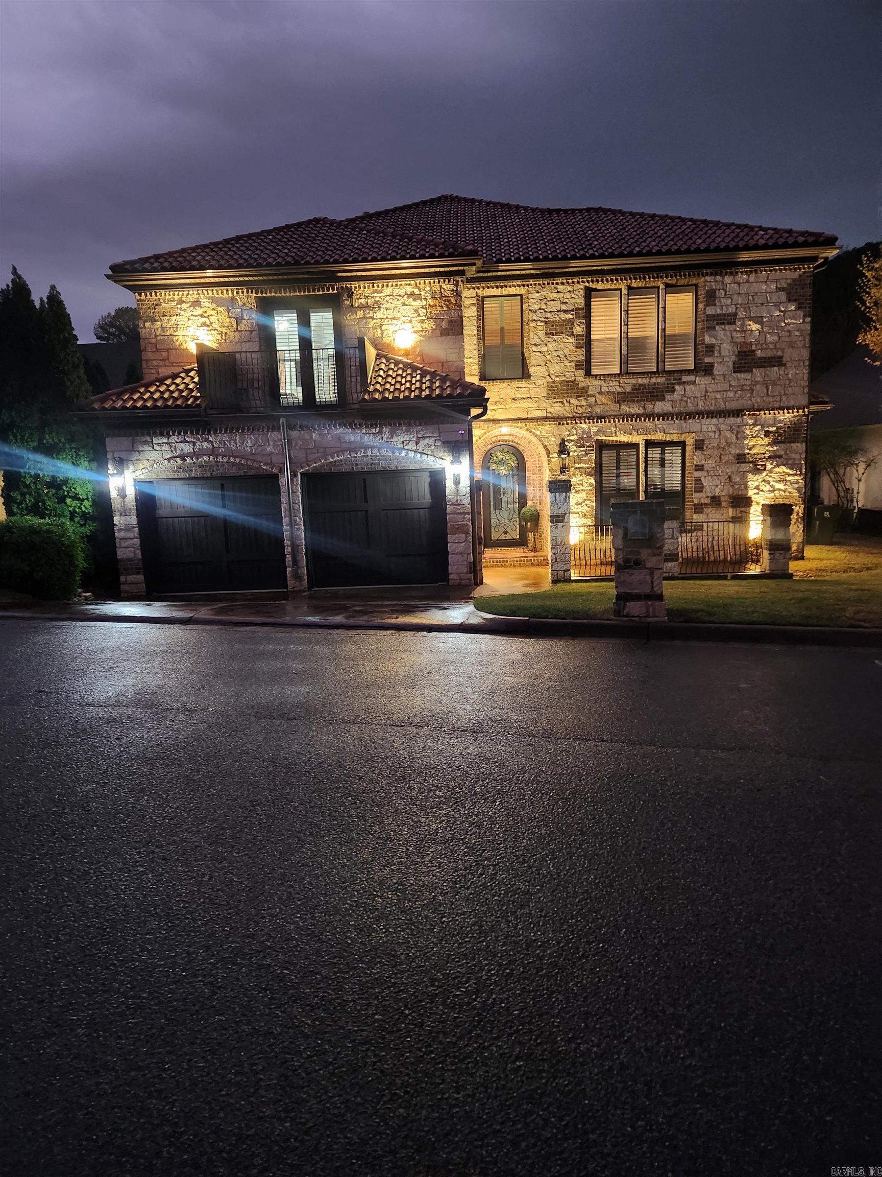 24hr notice to show: This beautiful home has custom architectural detail that will amaze you! Two story great room with arched detail, dining with full-service bar, gourmet kitchen- heavy granite counter tops, double oven, and your very own wine cellar! An awesome custom movie theatre with remote controlled window covers 2-bedroom suites & open loft upstairs. Guest suite and Primary suite located downstairs! The Primary bedroom boasts cherry wood floors, sitting area, private patio access, 2 showers (1 steam) & jacuzzi tub with attached walk-through laundry. Large walk - in closets! Enjoy outdoor entertaining on stone patio/courtyard that overlooks fenced yard with a creek and permanent green space for privacy, Custom Real Wood window blinds, remote controlled window coverings! Automatic blinds in theatre room. **HOME WARRANTY**