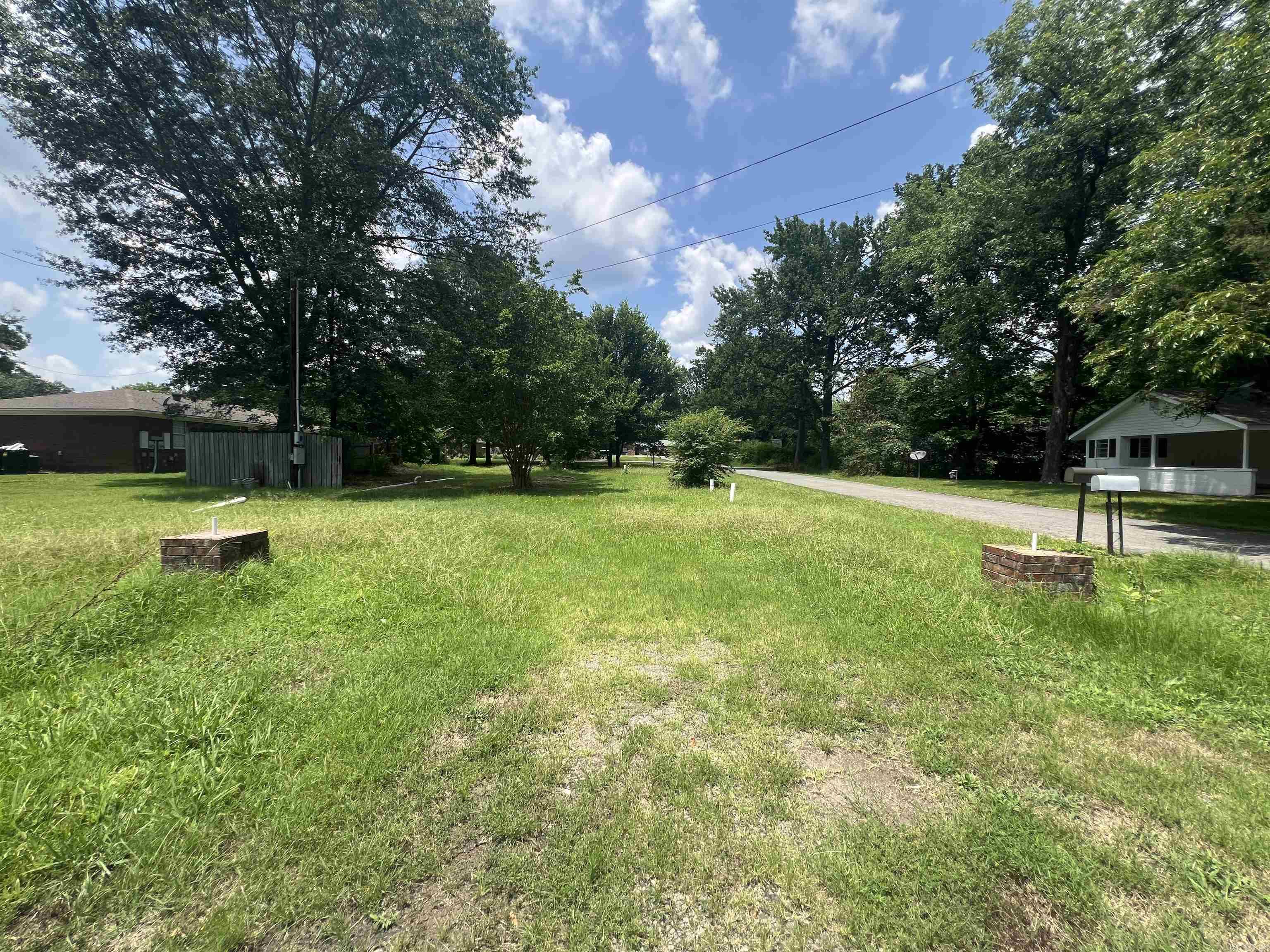 The zoning regulations for this property permit the construction of commercial, retail, or residential duplexes and triplexes providing flexible options for potential buyers or developers. This desirable corner lot features convenient on-site utilities, ensuring a seamless development process. Its prime location offers both accessibility and a variety of possibilities for creating a dream residence or investment property. Moreover, the lot's corner positioning allows for greater design flexibility and enhanced curb appeal. With essential utilities already in place, you can save time and costs on development preparations. This lot offers a rare blend of convenience and potential. Don't miss out on the chance to build and customize your ideal living space in this community! SEE REMARKS