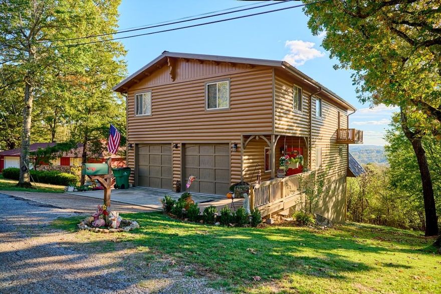 4 bedrooms,  3 full baths, attached oversized  2 car garage-all updated and remodeled. With over 3900 sq. ft. m/l, there is plenty of room for comfortable living and lots of storage space. New flooring, paint, plumbing, all new deck were completed over the past year.   From that new deck is a  stunning  overview of Cherokee Village and the surrounding terrain. Watch eagles soar by and the setting sun dipping over the horizon while supping an evening treat. The main level is a semi-open floor plan with a vaulted ceiling living room, kitchen and breakfast nook, and dining area. A 4th bedroom, bathroom and laundry round out the main floor living area.   The large main bedroom is on the second level.  It's adjoining bath has both tub and separate shower and twin vanities. A reading nook provides both a scenic view and a cozy spot for relaxing with a good book and  morning coffee.  Two additional bedrooms and bath are also on this level. There is even a "parlor" perfect for an internet gaming enthusiast or just watching a good movie. To round out this ideal home site, the second lot is suitable for  RV parking, a garage even.