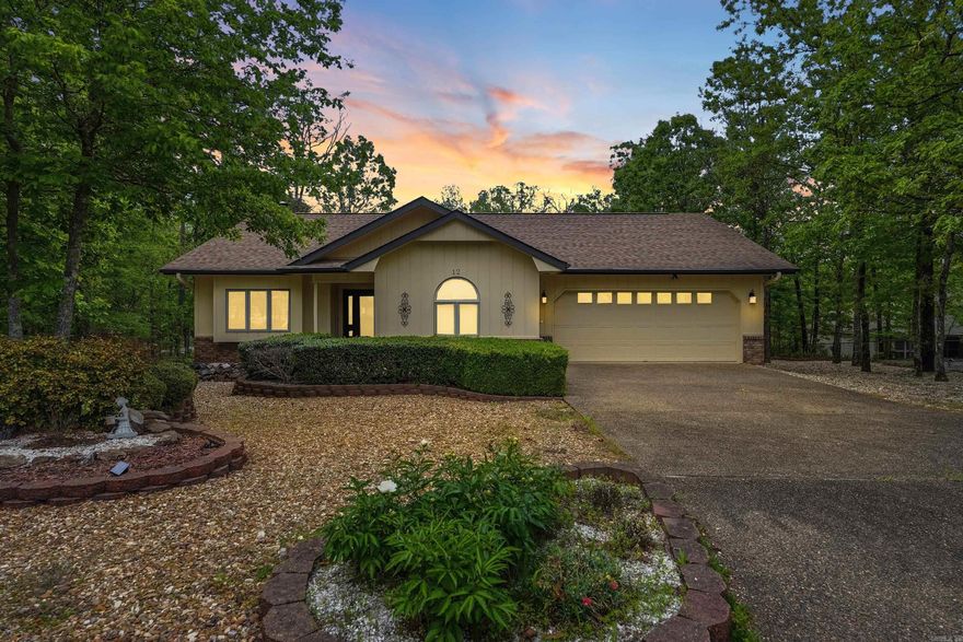 Tucked away at the end of a quiet cul-de-sac, this home includes the lot next door for added privacy and room to breathe. Step inside to a light-filled living room with vaulted ceilings and a cozy gas log fireplace that opens seamlessly to a partially covered back deck, perfect for relaxing or entertaining year-round. The dining area features an elegant tray ceiling and a charming bay window that fills the space with natural light. The well-designed kitchen offers ample cabinetry, generous counter space, and a walk-in pantry. The primary suite is a true retreat with a walk-in closet plus a bonus closet for extra storage. This home has been lovingly maintained and thoughtfully updated, with fresh interior and exterior paint, Andersen windows, a 7-year-old Lennox heat pump, a 7-year-old roof, and newer gutter guards in the back. Move-in ready, inside and out. Life in Hot Springs Village means access to world-class amenities, including 9 golf courses, 11 lakes, pickleball, hiking trails, a white sand beach, tennis, a fitness center, and both indoor and outdoor pools. All just 30 minutes from Hot Springs or Benton, and one hour from the Little Rock airport. Welcome home!