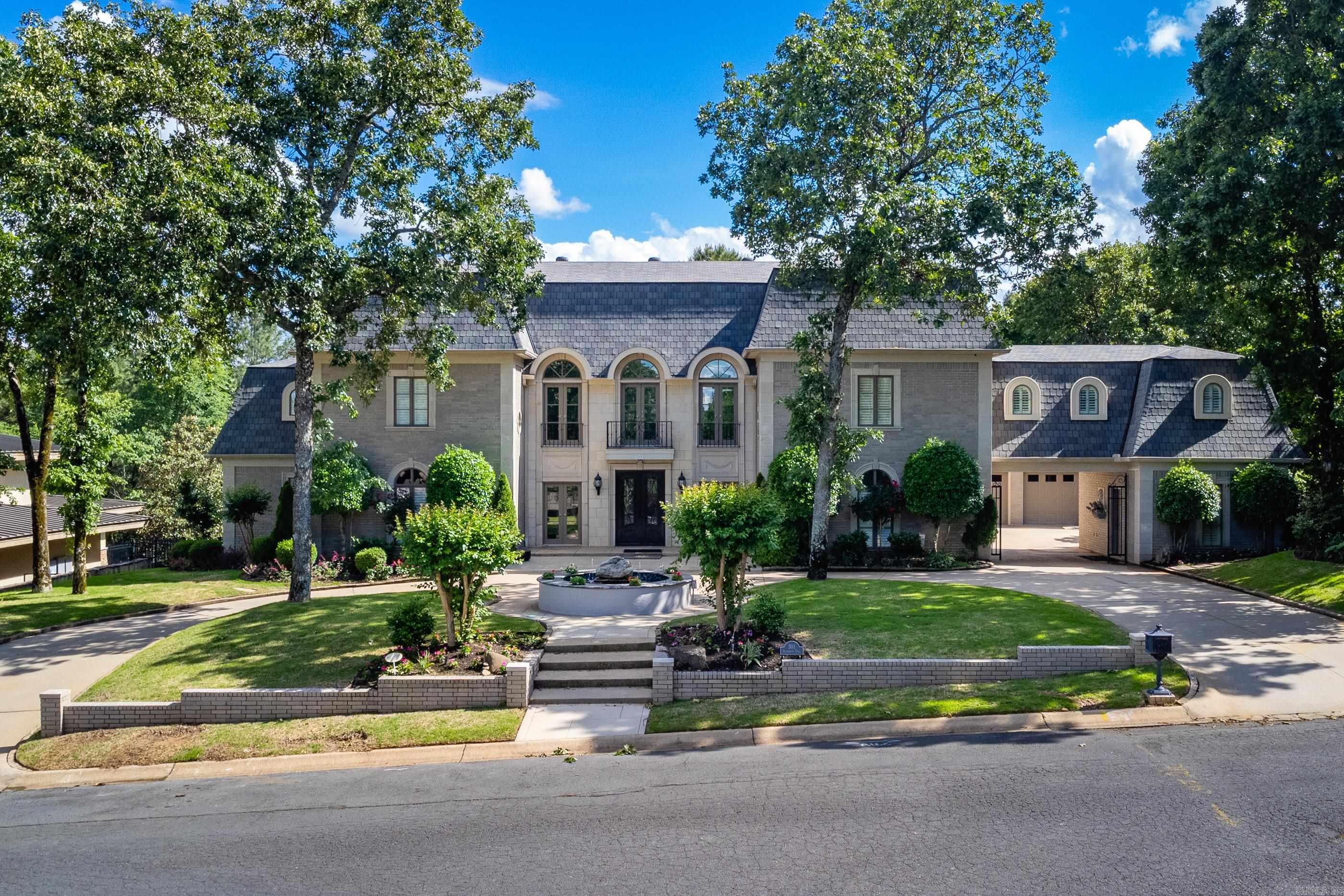 This fully updated, custom built beautiful estate in highly sought after Shady Valley neighborhood has everything! Entertain in the gorgeous backyard with an outdoor gas grill/kitchen area, inground pool, hot tub, and extensive landscaping that backs up to green space. Inside are 5 bedrooms, 4 full and 2 half baths, an office, multiple living and dining spaces, a remodeled kitchen with quartzite counters, Sub-zero fridge, ice machine, trash compactor, double ovens, gas cooktop, and large pantry. Entertain guests inside in the game room or show a movie in the fully equipped home theater. Work out in one of the lowest level 2 home gym/fitness areas that overlook the pool. Additional features include a full home generator, sprinkler system, alarm system, 2 car garage plus separate 1 car garage joined by the portico for vehicle or additional storage. Not all rooms shown in photos due to limited MLS space. Agents, see list of extensive updates in documents tab. Appointment required!