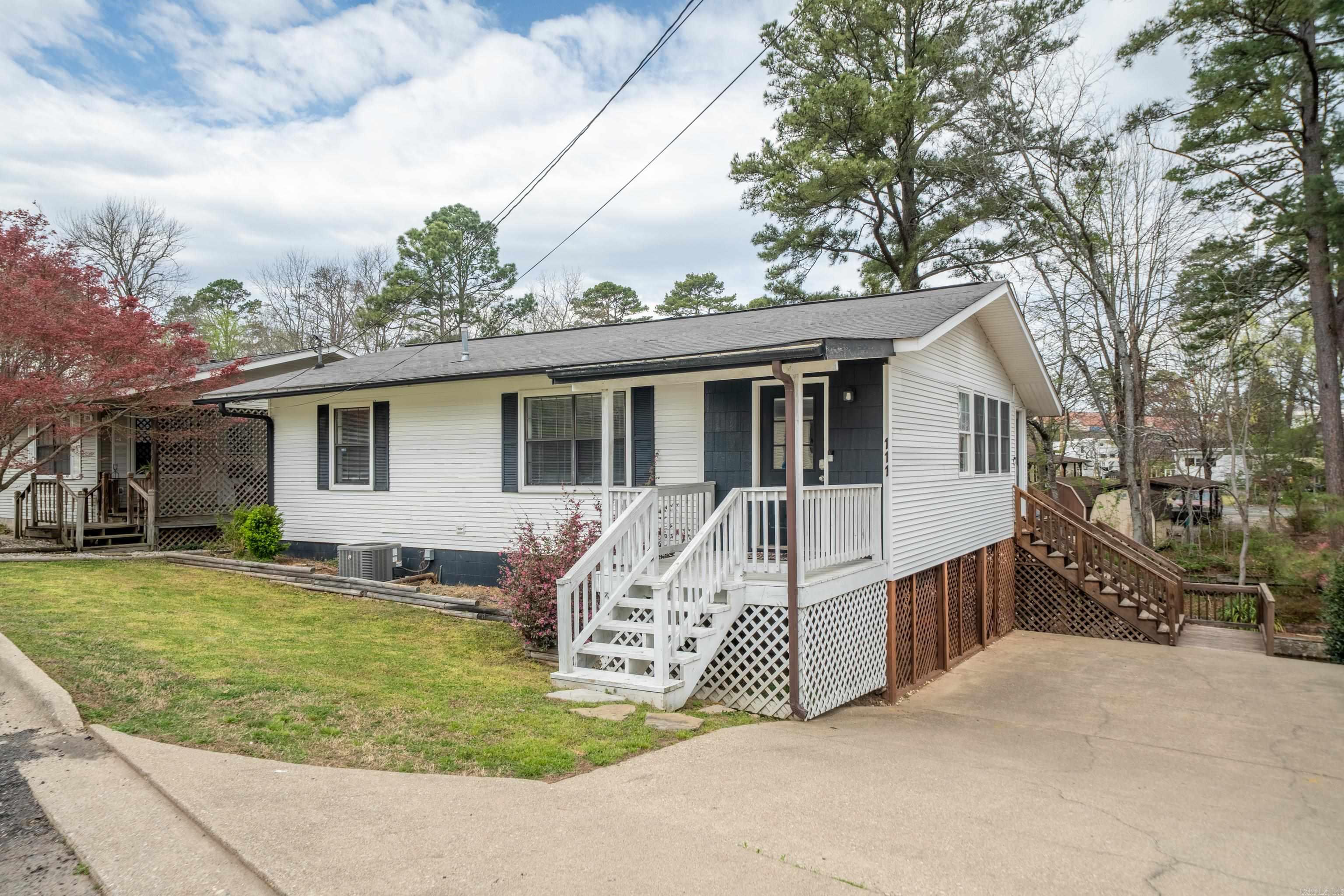 Beautifully remodeled waterfront home on Lake Hamilton! This stunning 3 bedroom, 2 bathroom home on Lake Hamilton is turn key and move in ready! Offering approximately 1,250 sq.ft., this home features an open floor plan, modern finishes, and custom tile showers.The kitchen boasts stainless steel appliances, perfect for entertaining or enjoying lakeside living. Conveniently located to restaurants and shopping, this home is ideal for a primary residence, vacation home, or investment property. Currently operating as a successful short term rental, this property offers endless potential with no POA dues! Don't miss this rare opportunity to own a piece of lakefront paradise in Hot Springs!