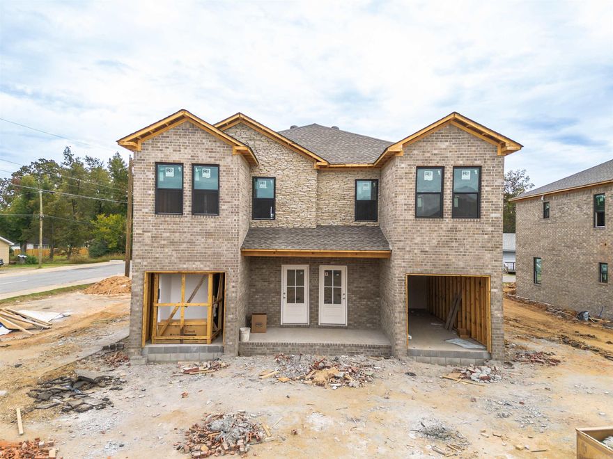 Look at these beauties! All brick/stone NEW CONSTRUCTION DUPLEXES in the heart of Jacksonville! Each unit is 3bed/2 1/2 bath! One car garage opens into the downstairs living space with a half bath for convenience. Upstairs contains primary bedroom at the back with its own bathroom and walk-in closet, as well as two additional bedrooms with a bathroom in-between. Hall laundry makes for the ultimate in convenience! Luxury vinyl throughout will make this renter-ready! This building has a twin going up next door. Interior photos are from a finished unit nearby. 8 buildings left of these new duplexes! See AGENT REMARKS