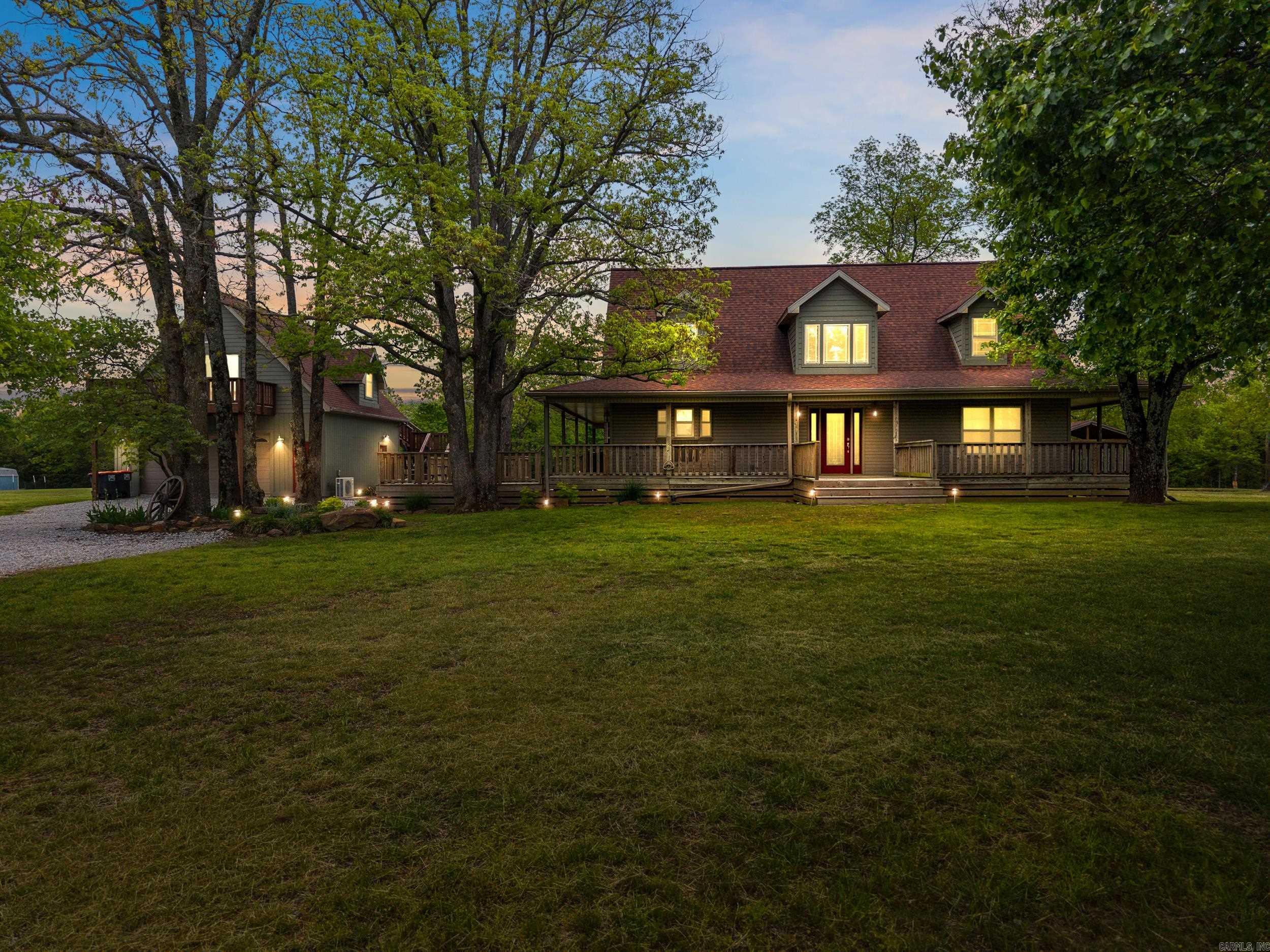 Welcome home to your own turnkey ranch! This 2,900 sq ft country retreat features a wrap-around porch and a 3-bed, 2-bath home with a luxurious master suite, dual walk-in closets, Jacuzzi tub, and oversized shower. The open living area includes wood floors, a wood-burning fireplace, and a chefās kitchen with a large island, six-burner cooktop, built-in oven, pantry, and premium finishes. A laundry/mudroom adds storage, hookups, and a half bath. Upstairs, two bedrooms share a bath and have triple closets, with a loft-style overlook. The home is powered by a 500-gallon propane tank and a 22KW Generac generator for backup. The oversized garage features a 20x30 media room with wet bar, mini-split HVAC, and walk-out decks. The 18x30 gazebo is perfect for entertaining with a gas grill, stone fireplace, ceiling fans, and LED lighting. Equestrian amenities include a 2,900 sq ft barn, 3 climate-controlled stalls, heated troughs, wash bay, tack room, and chicken coop. The property also includes fenced pastures, a raised-bed garden, and stocked pond. A full-price offer includes a Kubota RTV 900 with 3000 lb wench, front and back LED lighting and HYD Dump Bed, AND farm equipment.